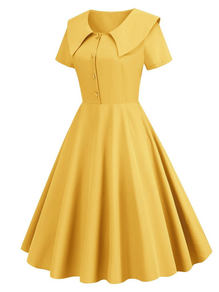 She slips into this 1950s Solid Lapel Swing Dress and suddenly it's a 1950s daydream