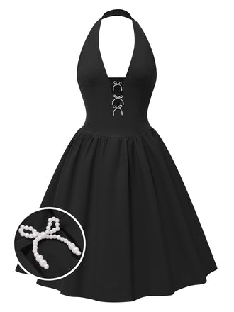 She slips into this 1950s Solid Bow Halter Dress and suddenly it's a 1950s daydream