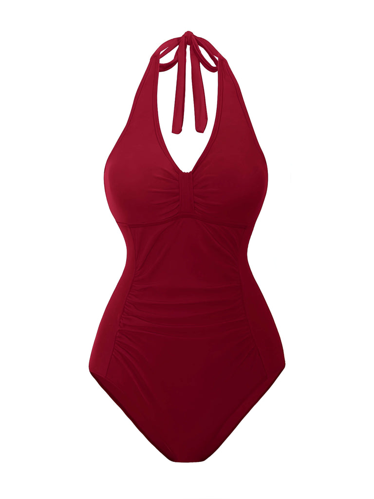 She's wearing 1950s Solid V-Neck Ruched Halter One-Piece Swimsuit and the whole beach remembers the 1950s