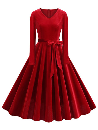 She slips into this 1950s Solid Velvet V-Neck Swing Dress and suddenly it's a 1950s daydream