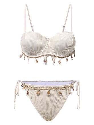 She's wearing 1950s Spaghetti Strap Beach Seashell Starfish Bikini and the whole beach remembers the 1950s