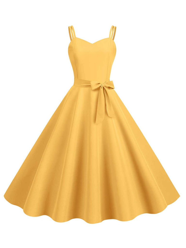 This 1950s Spaghetti Strap Bow Decor Solid Dress wraps her in 1950s elegance, one twirl at a time