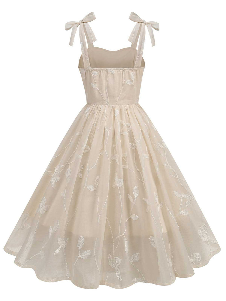 She slips into this 1950s Spaghetti Strap Bow Leaves Mesh Dress and suddenly it's a 1950s daydream