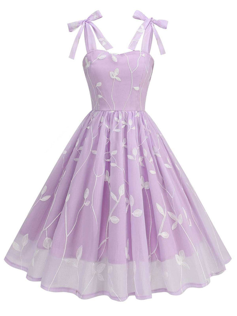She slips into this 1950s Spaghetti Strap Bow Leaves Mesh Dress and suddenly it's a 1950s daydream
