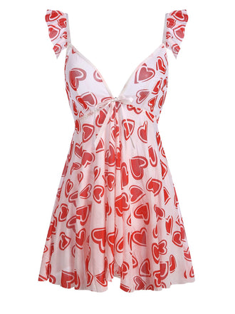 She slips into this 1950s Spaghetti Strap Heart Ruffles Mini Nightgown and suddenly it's a 1950s daydream