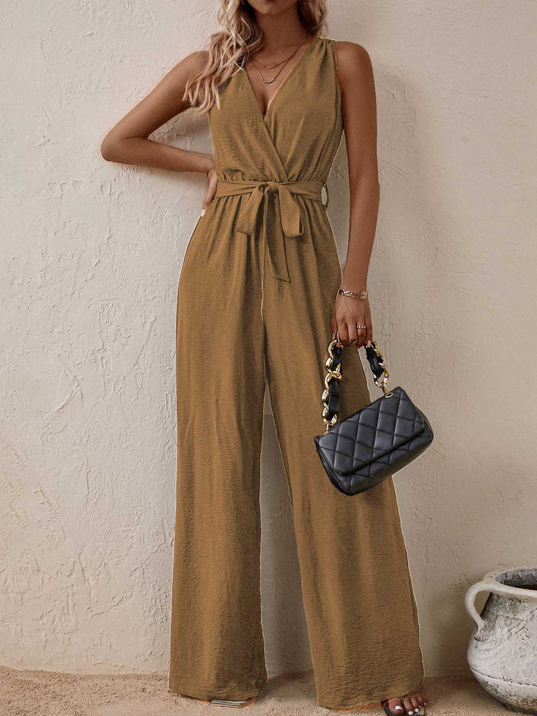She adds this 1950s Surplice V-Neck Solid Belted Jumpsuit and suddenly it's 1950s perfection