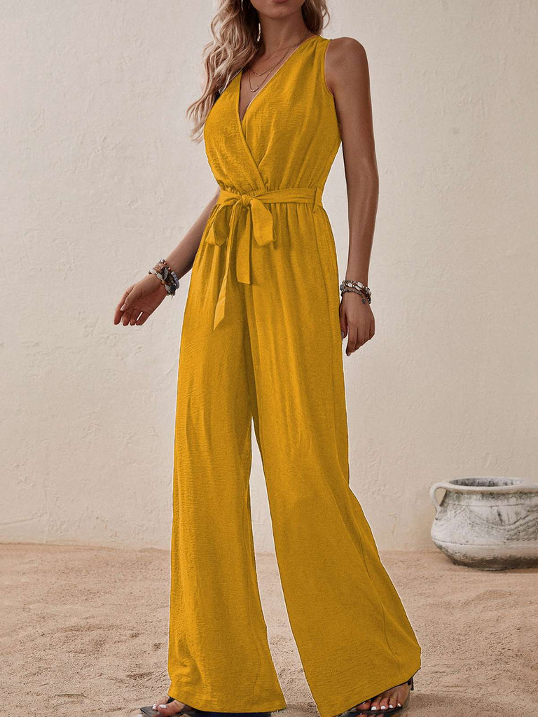 She adds this 1950s Surplice V-Neck Solid Belted Jumpsuit and suddenly it's 1950s perfection