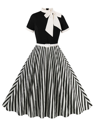 She slips into this 1950s Tie Neck Black & White Stripes Belted Dress and suddenly it's a 1950s daydream