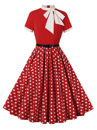 She slips into this 1950s Tie Neck Polka Dots Belted Dress and suddenly it's a 1950s daydream