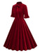 She slips into this 1950s Tie Neck Velvet Flared S