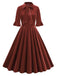 She slips into this 1950s Tie Neck Velvet Flared S