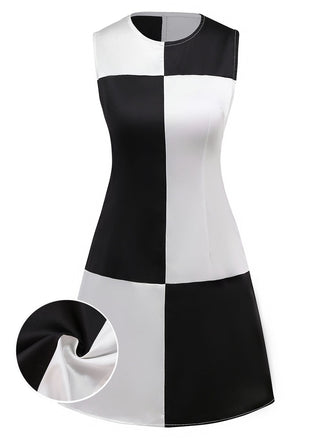 She slips into this 1960s Black And White Color Block Dress and suddenly it's a 1960s daydream