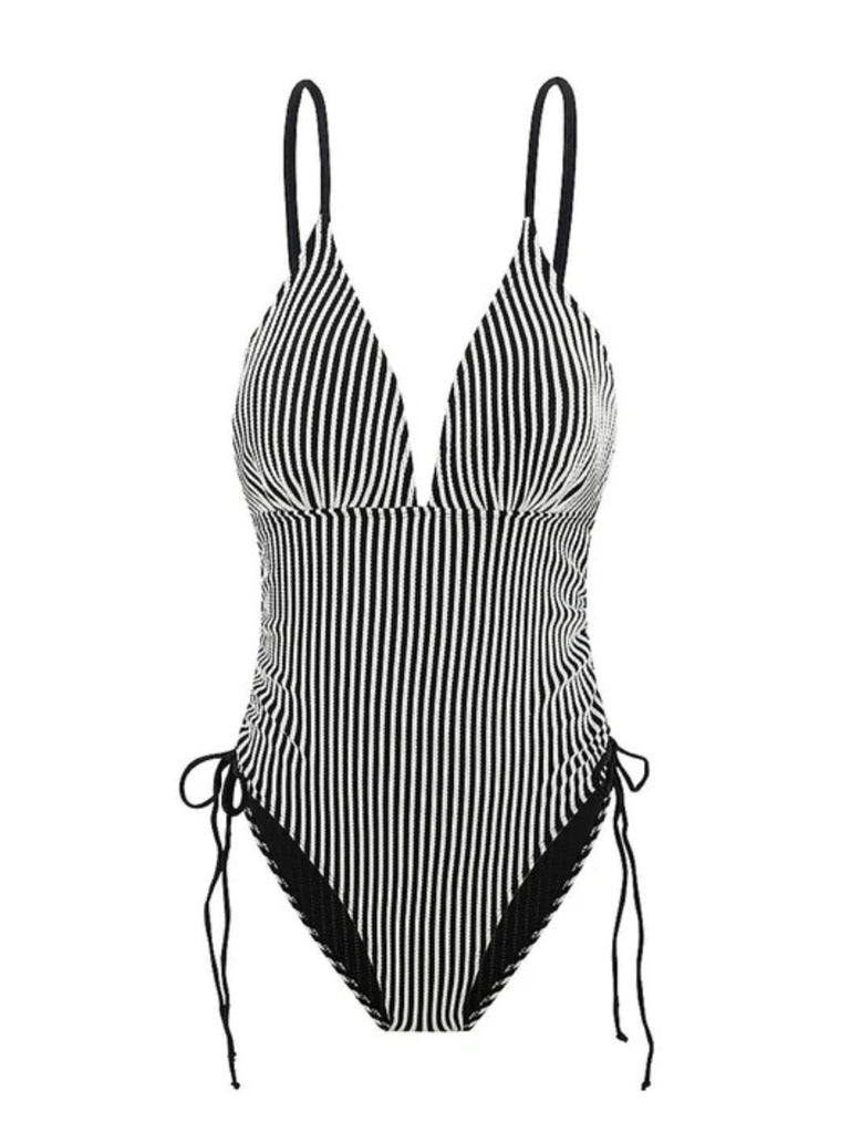 She's wearing 1960s Spaghetti Strap Contrast Stripes One-Piece Swimsuit and the whole beach remembers the 1960s