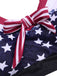 This 1960s Strap Stars Stripes Bow Bikini carries 1960s vacation dreams in every stitch