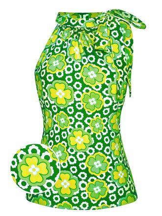 She pairs this 1960s Tie Neck Floral Sleeveless Top with confidence and 1960s charm