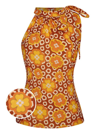 She pairs this 1960s Tie Neck Floral Sleeveless Top with confidence and 1960s charm