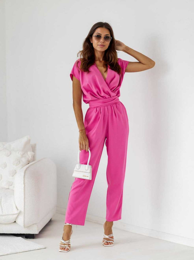 1960s V-Neck Belted Solid Jumpsuit — the 1960s finishing touch that makes her outfit sing