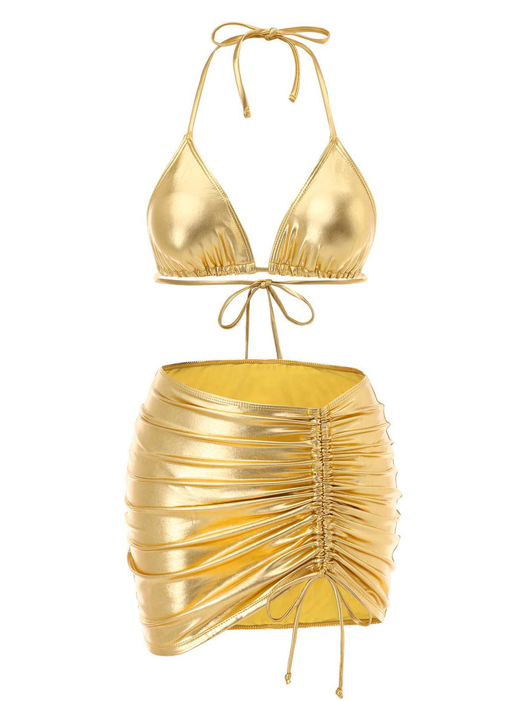 She's wearing 1970s Halter Metallic Bikini & Ruched Cover-Up and the whole beach remembers the 1970s
