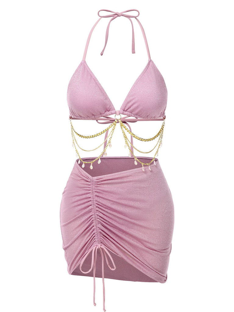 She's wearing 1970s Halter Shimmery Chain Crystal Bikini & Cover-Up and the whole beach remembers the 1970s
