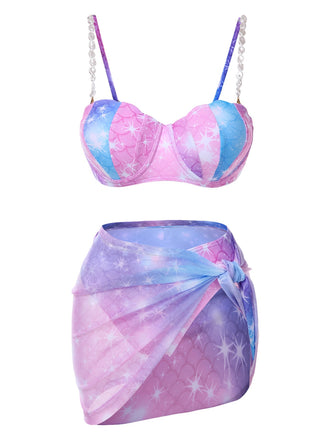 She's wearing 1970s Shell Pearl Chain Swimsuit & Cover-Up and the whole beach remembers the 1970s