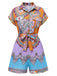 She pairs this 1970s Shirt Neck Paisley Print Belted Romper with confidence and 1970s charm