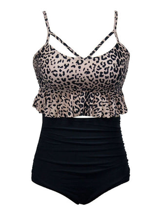 She's wearing 1970s Tummy Control Leopard Ruffled Tankini Set and the whole beach remembers the 1970s