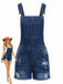 Blue denim overalls with a doll wearing them on a white background