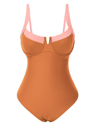 She's wearing 1980s Colorblock Strap High-Leg One-Piece Swimsuit and the whole beach remembers the 1980s