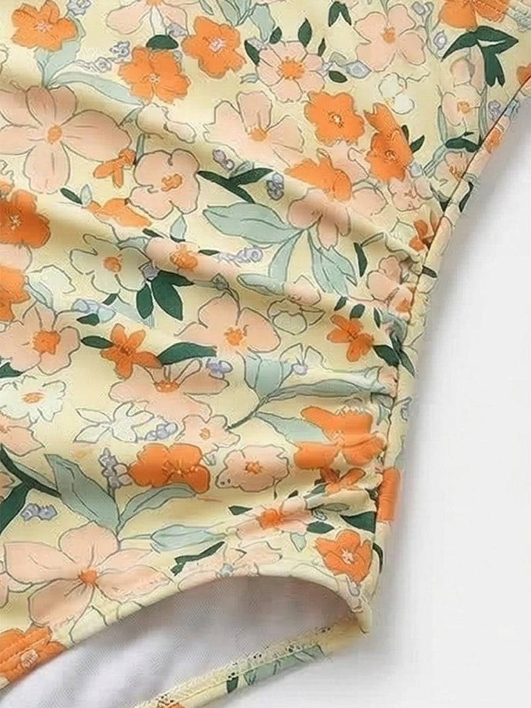 1980s Floral V-Neck Ruched One-Piece Swimsuit: beautiful vintage swimwear, retro swimsuit, pin-up style with timeless appeal