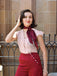 She pairs this 2PCS 1950s Red Polka Dot Blouse & Burgundy Pants with confidence and 1950s charm