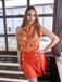 She pairs this 2PCS 1960s Tie Neck Floral Top & Button Solid Skirt with confidence and 1960s charm