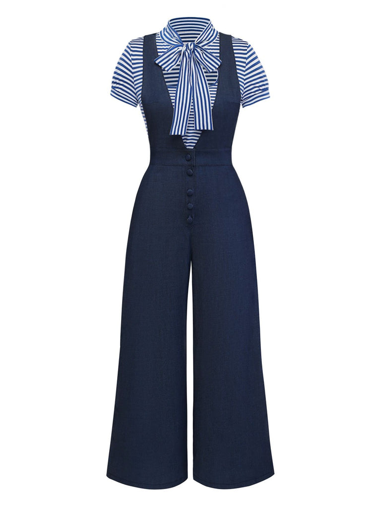 Full-length front view of a vintage-inspired navy blue wide-leg jumpsuit with button detailing on the bodice.