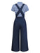Back view of the navy jumpsuit highlighting the elegant criss-cross strap design and wide-leg cut.