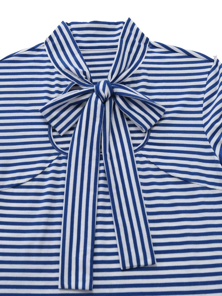 Close-up of the striped bow neckline showing the intricate tie detail and fabric pattern.