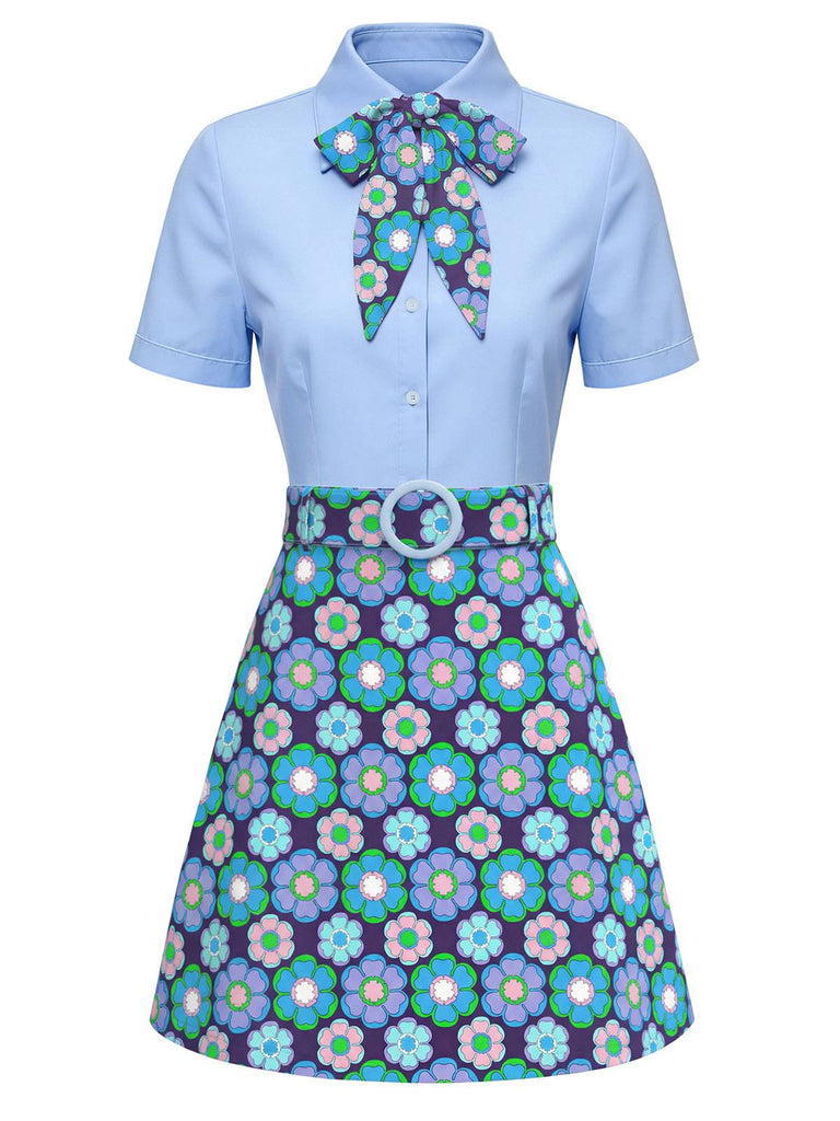 Light blue dress with floral patterned bow and skirt on a white background