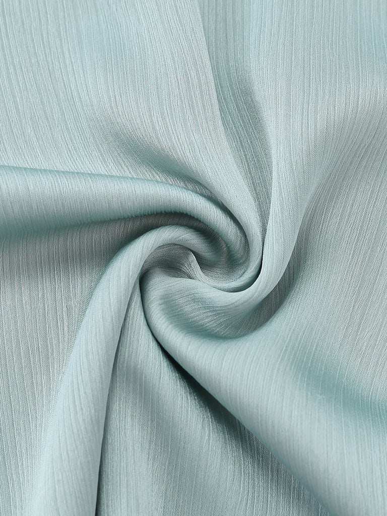 Close-up of light blue fabric with a subtle texture