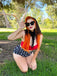 She's wearing 2PCS Red 1940s Dots Halter Swimsuit and the whole beach remembers the 1940s