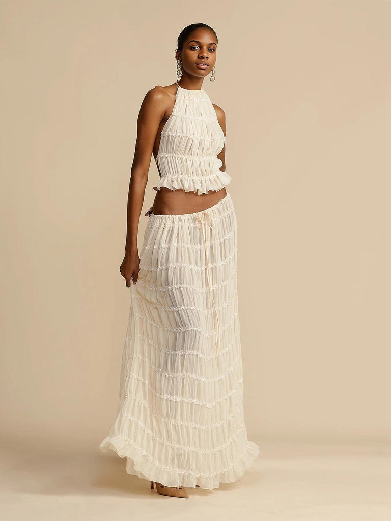 This 2PCS White 1970s Wrinkle Halter Backless Top & Skirts brings 1970s soul to her everyday