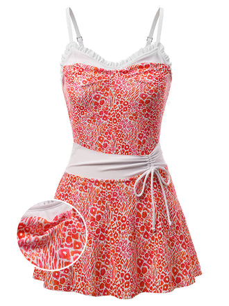 Vibrant red neon leopard print one-piece swimsuit with feminine ruffled trim and matching cover-up skirt, 1950s retro style perfect for beach parties