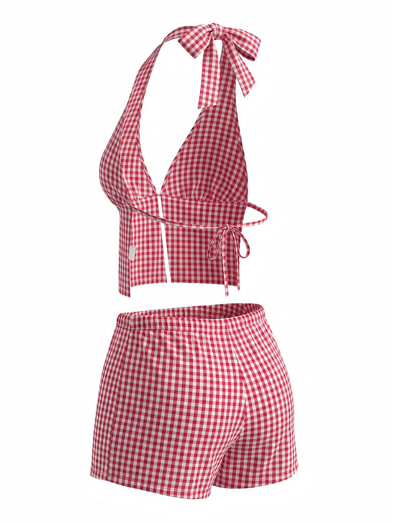 Red and white checkered two-piece swimsuit with a halter top and shorts on a white background