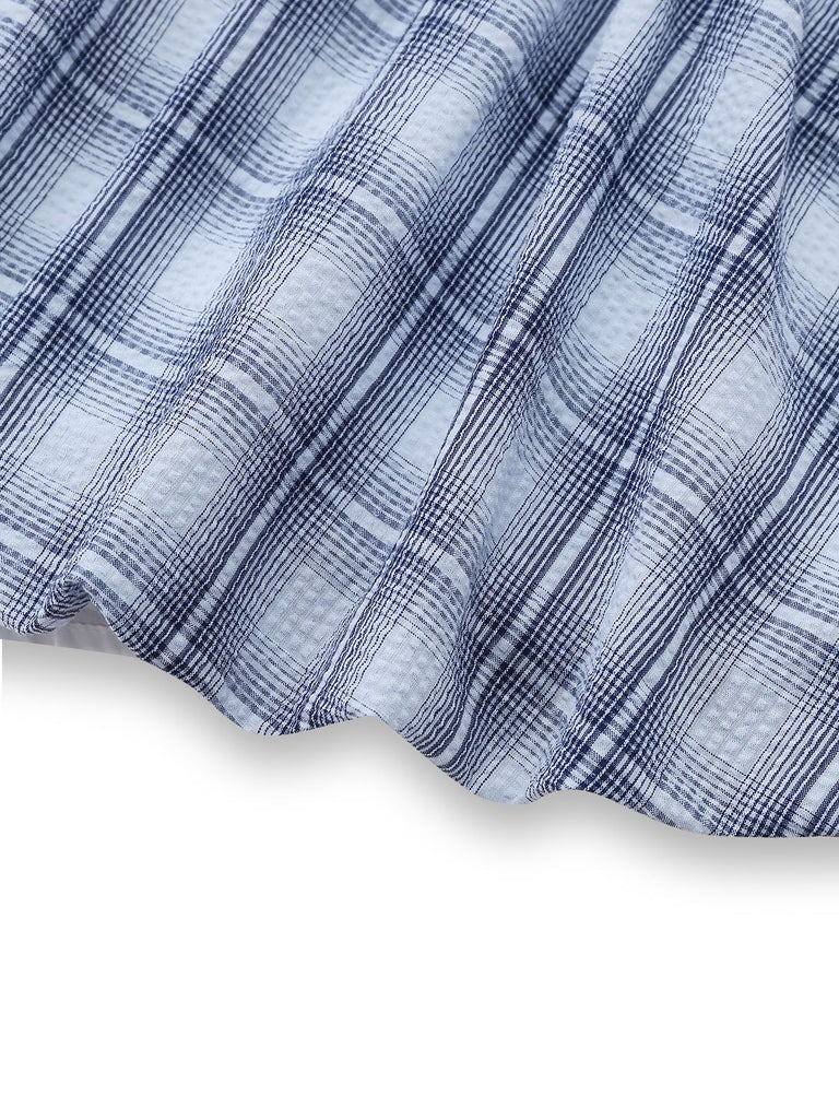 Close-up of blue and white checkered fabric on a white background