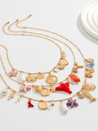 She's wearing 3PCS Layered Beach Charm Necklace Set and the whole beach remembers the vintage