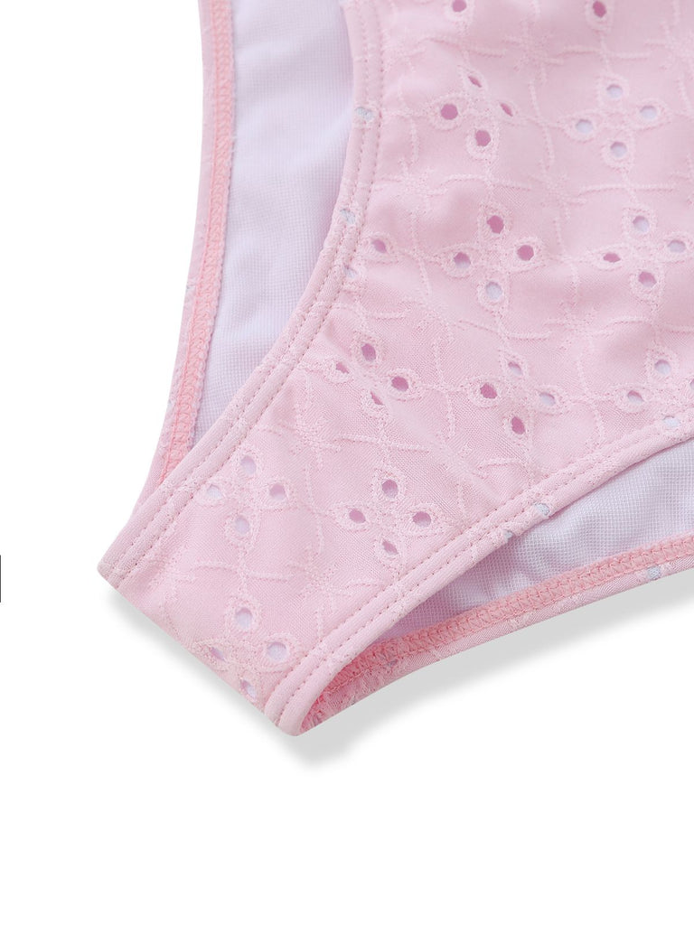 Close-up of pink underwear with a subtle pattern on a white background