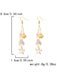 Gold earrings with starfish and shell designs, shown with measurements and weight on a white background.