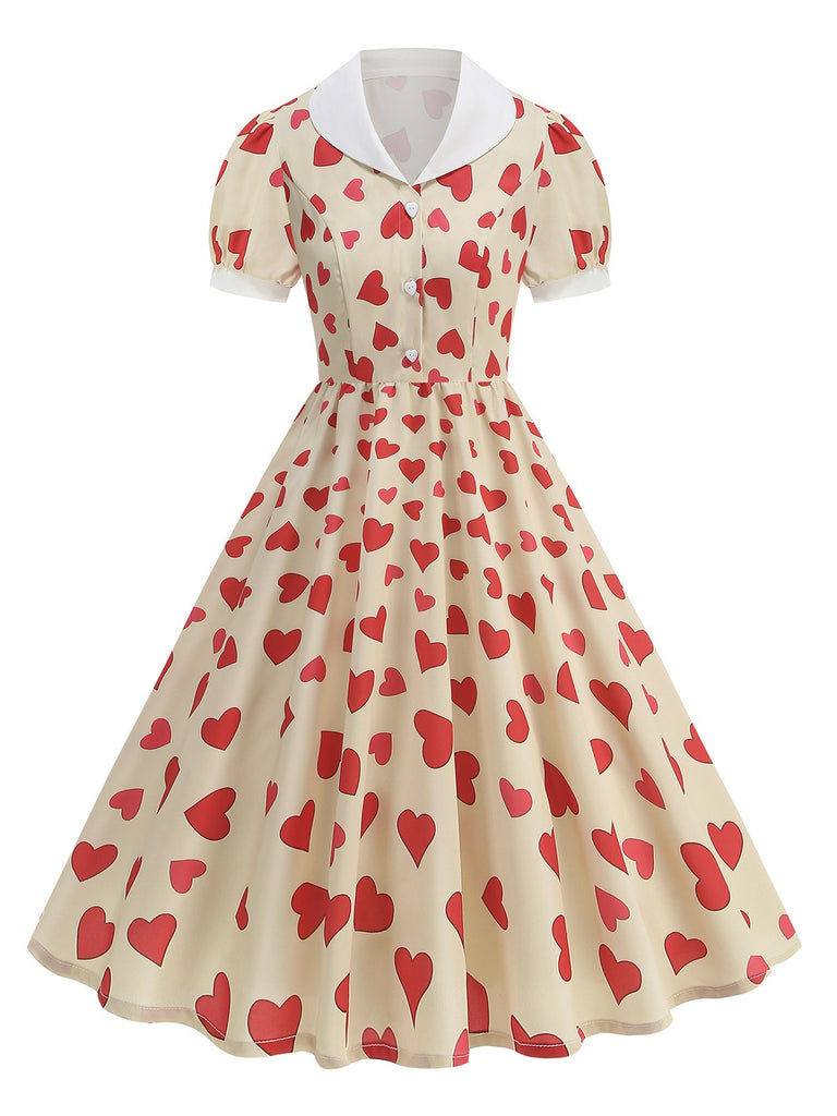 She slips into this Beige 1950s Hearts Puff Sleeves Lapel Dress and suddenly it's a 1950s daydream