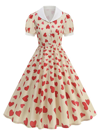 She slips into this Beige 1950s Hearts Puff Sleeves Lapel Dress and suddenly it's a 1950s daydream