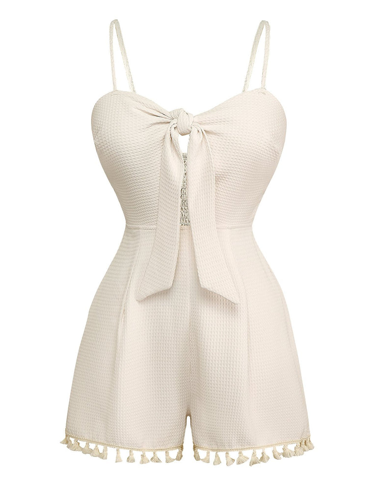 She finds her 1950s story in this Beige 1950s Solid Spaghetti Straps Smocked Romper