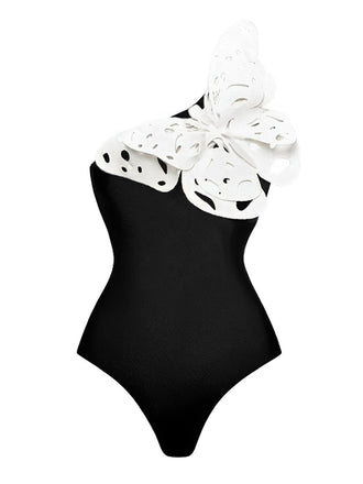 She's wearing Black 1930s 3D-Butterfly One-Shoulder Swimsuit and the whole beach remembers the 1930s