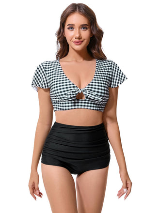 She's wearing Black 1930s Gingham Plaid Bow Ruched Swimsuit and the whole beach remembers the 1930s