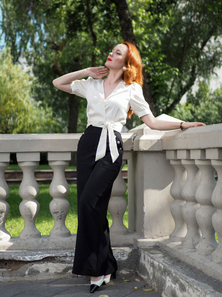 She walks in these Black 1930s Solid Suspender Pants and the world follows